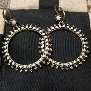 Bronze and white ornamental earings.